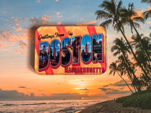 Load image into Gallery viewer, Vintage-style 'Greetings from Boston, Massachusetts' postcard dog id tag with a beach and palm trees at sunset background