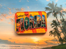 Load image into Gallery viewer, Vintage postcard inspired dog tag with the words Greetings from Florida on a beach background