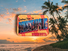 Load image into Gallery viewer, Vintage-style 'Greetings from Minneapolis, Minnesota' postcard dog id tag with palm trees and sunset over water.
