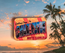 Load image into Gallery viewer, Vintage-style 'Greetings from Charleston, South Carolina' postcard design dog ID tag on a palm trees and sunset background 
