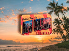 Load image into Gallery viewer, Vintage style post card dog id tag with 'Greetings from New Orleans, Louisiana' over a beach sunset scene background 
